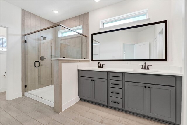 15147 Colorado Bend Park Dr, Cypress, TX 77433 - bathroom with double vanity, a shower stall, baseboards, and recessed lighting