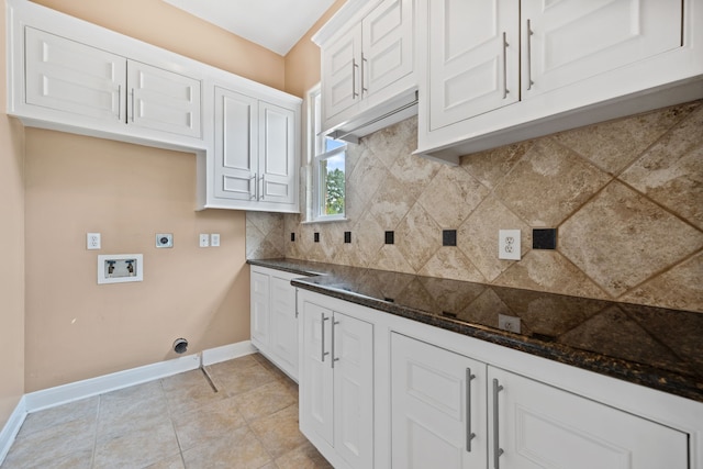 806 Quintana Roo Pl, Seabrook, TX 77586 - washroom with electric dryer hookup, cabinet space, baseboards, hookup for a washing machine, and light tile patterned floors