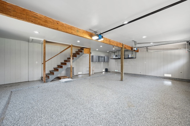 806 Quintana Roo Pl, Seabrook, TX 77586 - garage with a garage door opener, recessed lighting, and wooden walls