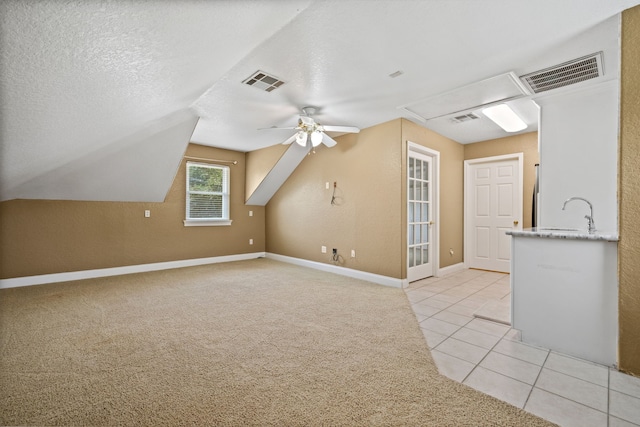 806 Quintana Roo Pl, Seabrook, TX 77586 - bonus room featuring light tile patterned flooring, ceiling fan, baseboards, a sink, and lofted ceiling