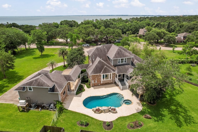 806 Quintana Roo Pl, Seabrook, TX 77586 - view of swimming pool with a pool with connected hot tub, a patio, and a water view