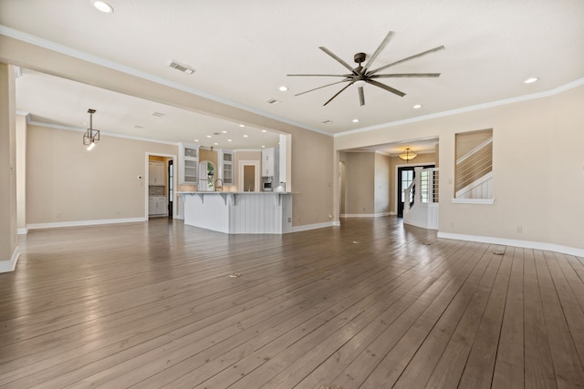 806 Quintana Roo Pl, Seabrook, TX 77586 - unfurnished living room featuring ceiling fan, baseboards, crown molding, hardwood / wood-style flooring, and recessed lighting