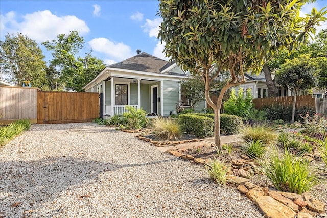 404 E 28th St, Houston, TX 77008 - bungalow-style home featuring a gate, a porch, and a shingled roof