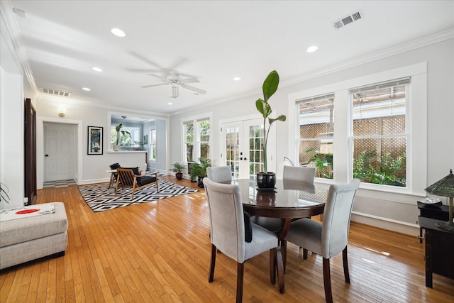 404 E 28th St, Houston, TX 77008 - dining area featuring ornamental molding, light wood finished floors, a ceiling fan, french doors, and baseboards