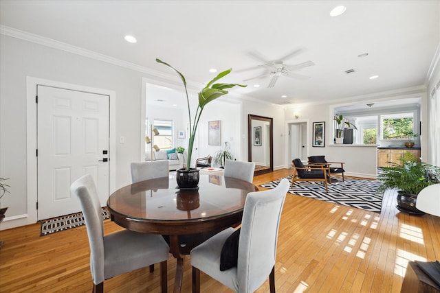 404 E 28th St, Houston, TX 77008 - dining space featuring light wood-type flooring, ornamental molding, recessed lighting, a ceiling fan, and baseboards