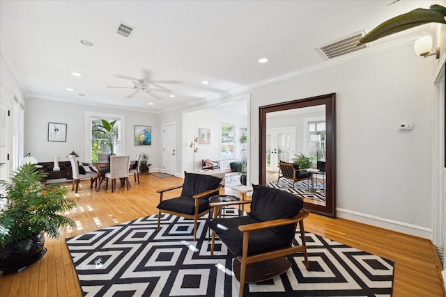 404 E 28th St, Houston, TX 77008 - living room with light wood finished floors, ornamental molding, recessed lighting, baseboards, and a ceiling fan