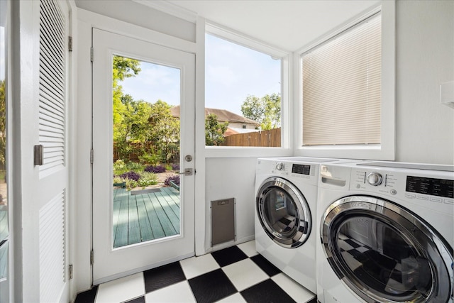 404 E 28th St, Houston, TX 77008 - laundry area with washing machine and clothes dryer and tile patterned floors