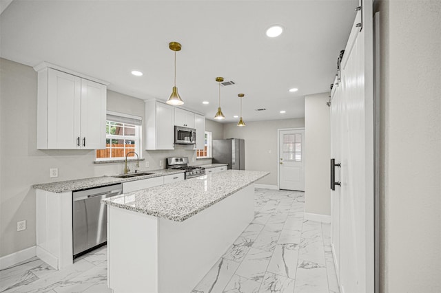702 Norell St, Channelview, TX 77530 - kitchen with stainless steel appliances, a sink, light marble finish flooring, baseboards, and recessed lighting