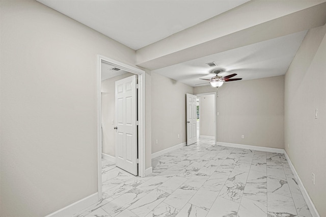 702 Norell St, Channelview, TX 77530 - unfurnished room with light marble finish floors, ceiling fan, and baseboards
