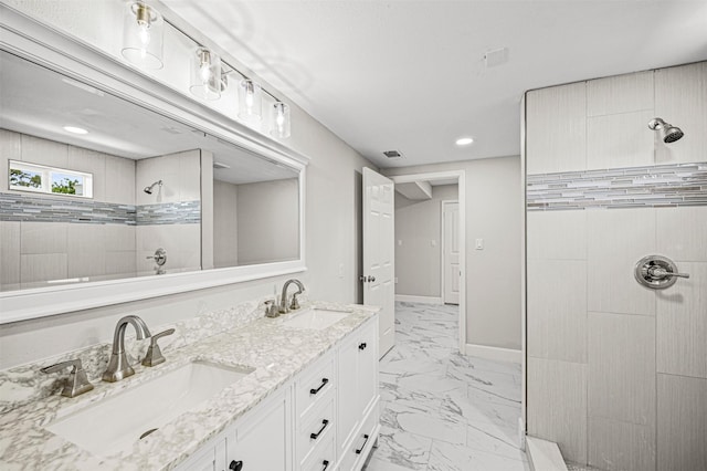 702 Norell St, Channelview, TX 77530 - bathroom featuring tiled shower, double vanity, marble look tile flooring, recessed lighting, and baseboards