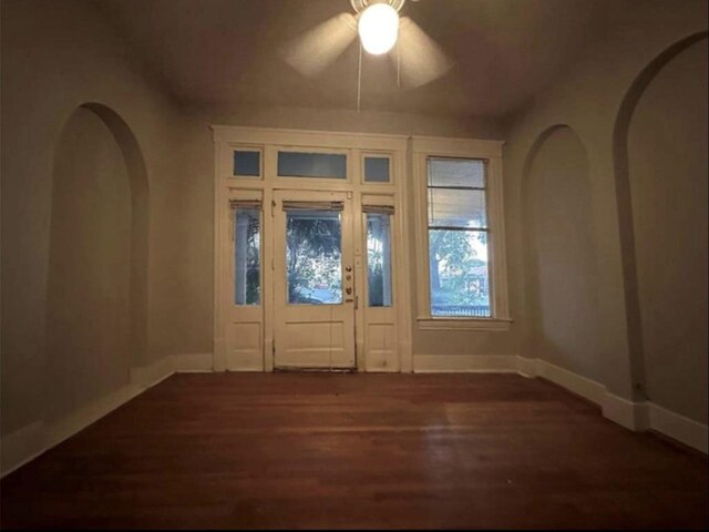 2518 Grant St, Houston, TX 77006 - entryway with wood finished floors, a ceiling fan, baseboards, and arched walkways