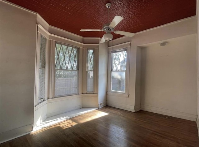 2518 Grant St, Houston, TX 77006 - unfurnished room with wood finished floors, a ceiling fan, baseboards, and an ornate ceiling