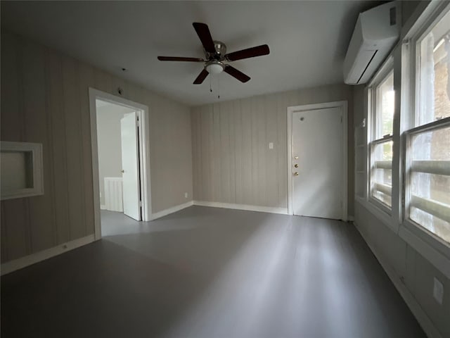 2518 Grant St, Houston, TX 77006 - empty room with a wall mounted AC and a ceiling fan