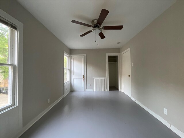 2518 Grant St, Houston, TX 77006 - spare room with concrete floors, ceiling fan, and baseboards