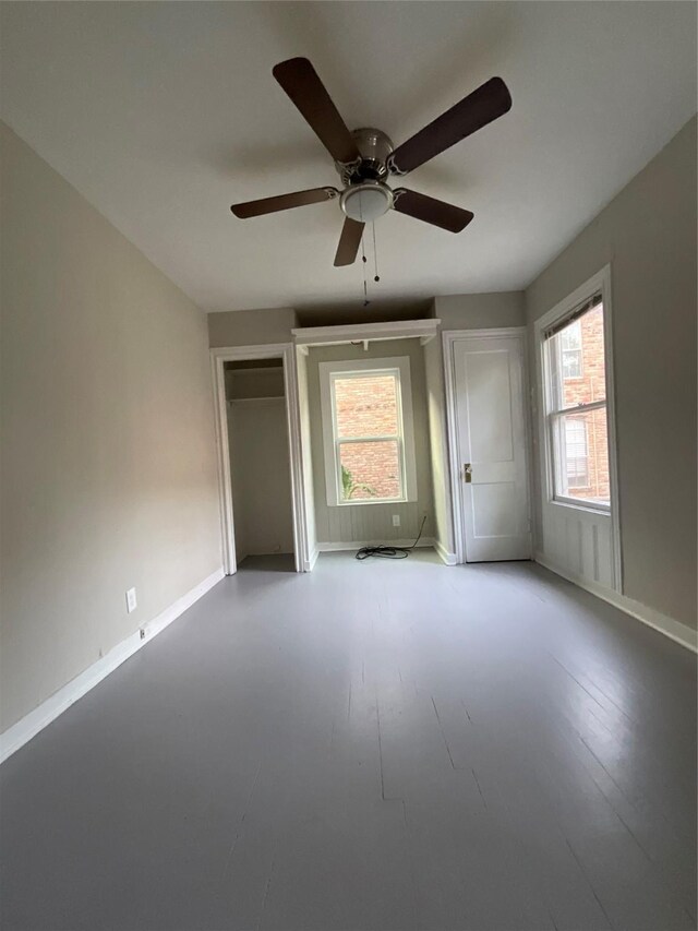 2518 Grant St, Houston, TX 77006 - unfurnished bedroom featuring baseboards and ceiling fan