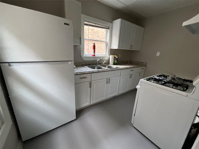 2518 Grant St, Houston, TX 77006 - kitchen with white appliances, a sink, wall chimney exhaust hood, and white cabinets