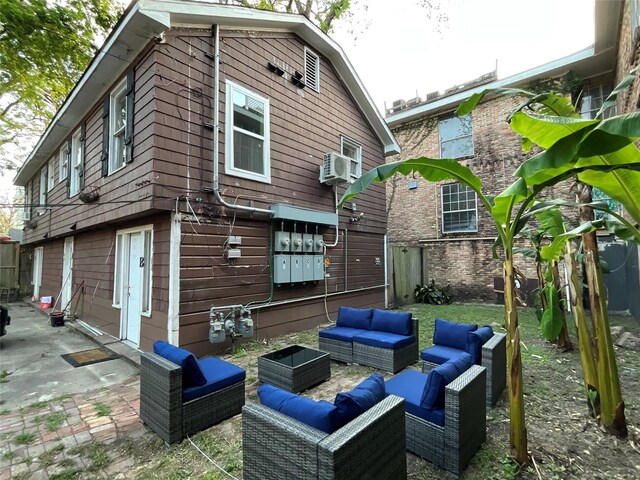 2518 Grant St, Houston, TX 77006 - back of property with outdoor lounge area, a patio area, and a fenced backyard