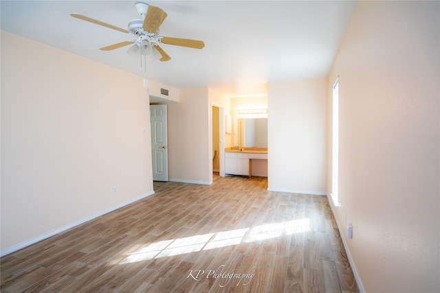 12500 Sandpiper Dr Unit 76, Houston, TX 77035 - spare room featuring wood finished floors, baseboards, and a ceiling fan
