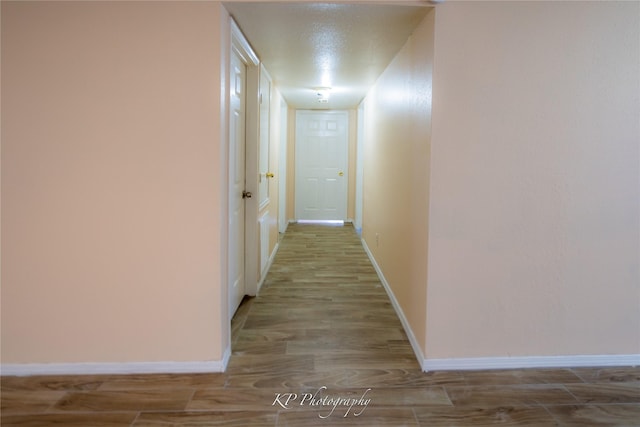 12500 Sandpiper Dr Unit 76, Houston, TX 77035 - hall with wood finished floors and baseboards