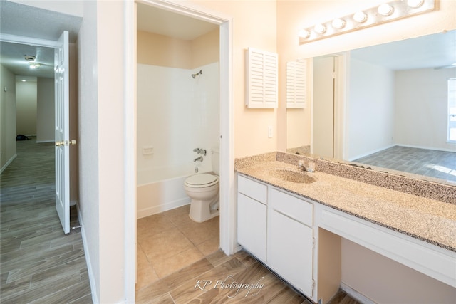 12500 Sandpiper Dr Unit 76, Houston, TX 77035 - bathroom with vanity, toilet, shower / tub combination, and wood finished floors