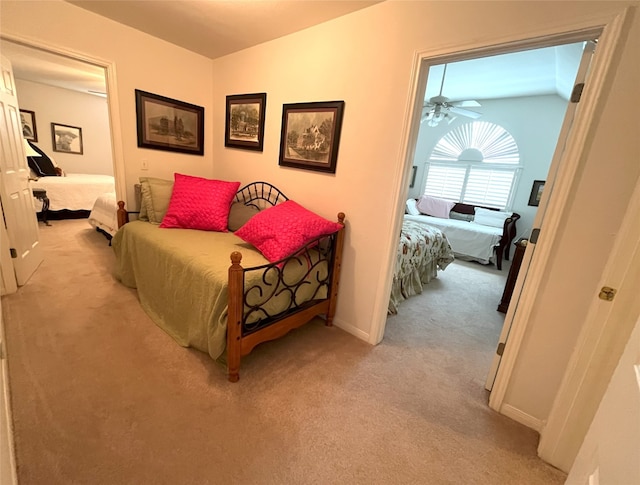 11683 Lakeshore Dr, Thornton, TX 76687 - bedroom with light colored carpet, lofted ceiling, and baseboards
