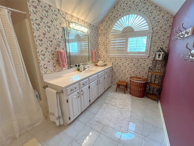 11683 Lakeshore Dr, Thornton, TX 76687 - full bathroom featuring lofted ceiling, wallpapered walls, vanity, and healthy amount of natural light