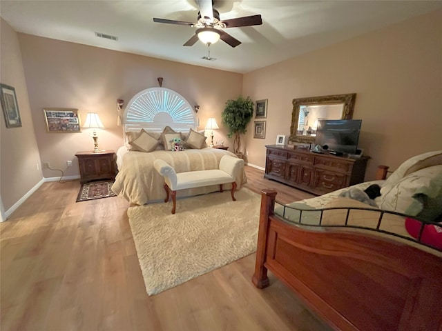 11683 Lakeshore Dr, Thornton, TX 76687 - bedroom with wood finished floors, a ceiling fan, and baseboards