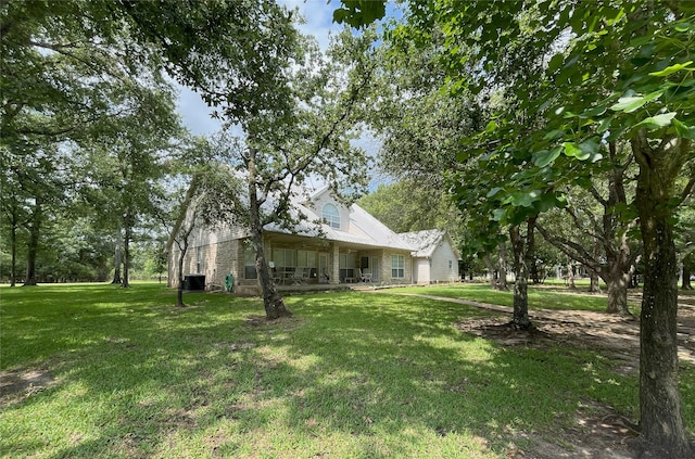 11683 Lakeshore Dr, Thornton, TX 76687 - view of grassy yard featuring central AC