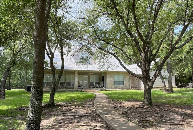 11683 Lakeshore Dr, Thornton, TX 76687 - view of front of house with a porch, a front lawn, and stone siding