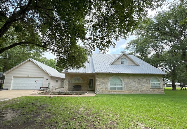 11683 Lakeshore Dr, Thornton, TX 76687 - view of front of property featuring stone siding, a front lawn, concrete driveway, and metal roof