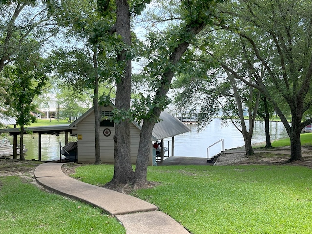 11683 Lakeshore Dr, Thornton, TX 76687 - view of property exterior featuring a dock, a water view, a yard, and boat lift