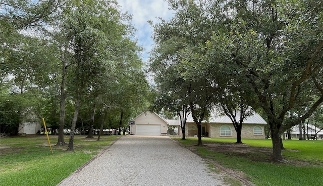 11683 Lakeshore Dr, Thornton, TX 76687 - view of front of home with a front yard, stone siding, and gravel driveway
