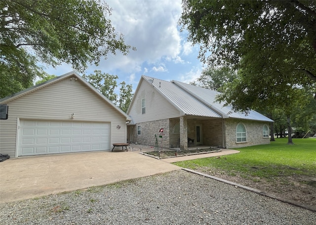 11683 Lakeshore Dr, Thornton, TX 76687 - view of front of home with stone siding, gravel driveway, a front yard, an outdoor structure, and metal roof