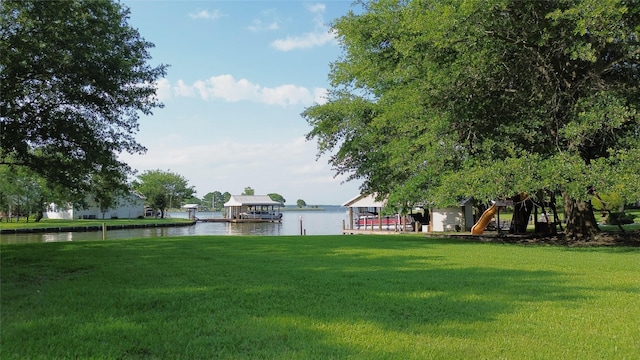 11683 Lakeshore Dr, Thornton, TX 76687 - view of grassy yard with a boat dock, a water view, and boat lift