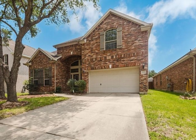 4615 Long Climb Cyn, Humble, TX 77396 - traditional-style house featuring brick siding, an attached garage, a front lawn, and driveway
