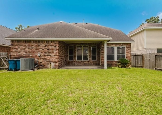 4615 Long Climb Cyn, Humble, TX 77396 - back of house featuring central air condition unit, brick siding, a patio, and a shingled roof