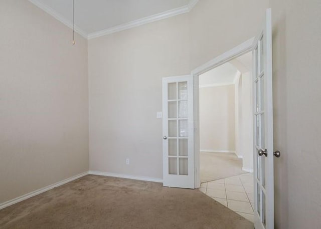 4615 Long Climb Cyn, Humble, TX 77396 - unfurnished room featuring light colored carpet, ornamental molding, french doors, baseboards, and light tile patterned floors