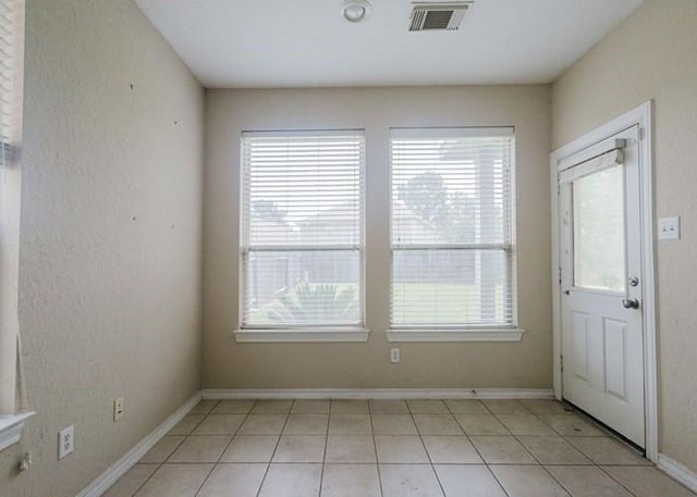 4615 Long Climb Cyn, Humble, TX 77396 - entrance foyer with plenty of natural light, light tile patterned floors, and baseboards