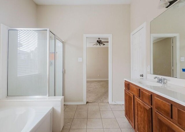 4615 Long Climb Cyn, Humble, TX 77396 - bathroom featuring vanity, a stall shower, a bath, tile patterned floors, and ceiling fan
