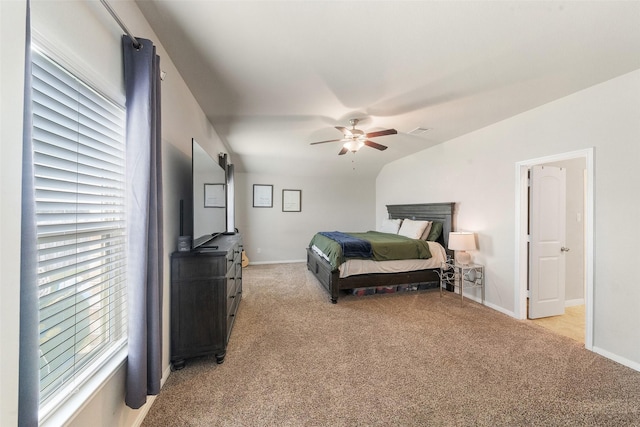 14207 Irvine Ranch Trl, Conroe, TX 77384 - bedroom with light colored carpet, baseboards, and ceiling fan