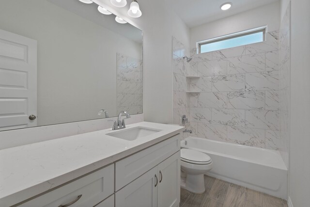 24696 Wicklow Rd, Hempstead, TX 77445 - bathroom featuring vanity, toilet, washtub / shower combination, and wood finished floors