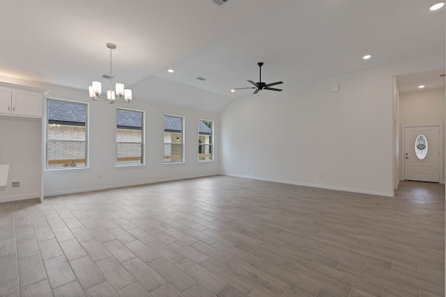 24696 Wicklow Rd, Hempstead, TX 77445 - unfurnished living room featuring ceiling fan, a chandelier, light wood-style floors, baseboards, and lofted ceiling