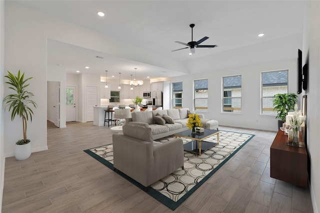 24696 Wicklow Rd, Hempstead, TX 77445 - living room with ceiling fan, light wood-style floors, baseboards, a chandelier, and recessed lighting