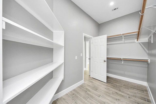 2448 Areba St, Houston, TX 77091 - walk in closet featuring wood finished floors