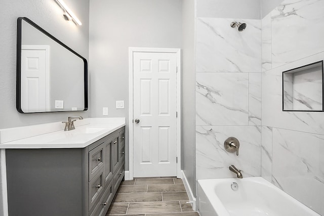 2448 Areba St, Houston, TX 77091 - full bathroom featuring vanity, washtub / shower combination, and wood tiled floors