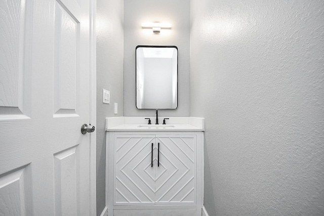2448 Areba St, Houston, TX 77091 - bathroom featuring a textured wall and vanity