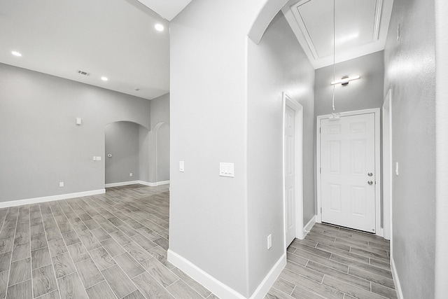 2448 Areba St, Houston, TX 77091 - corridor featuring arched walkways, attic access, wood finish floors, recessed lighting, and baseboards