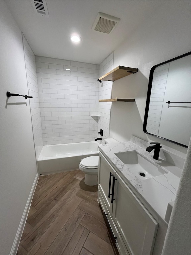 116 Capetown, Conroe, TX 77356 - full bathroom with vanity, toilet, shower / bathtub combination, parquet floors, and baseboards