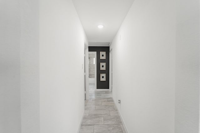 11819 Ryewater Dr, Houston, TX 77089 - corridor with light marble finish floors, baseboards, and recessed lighting