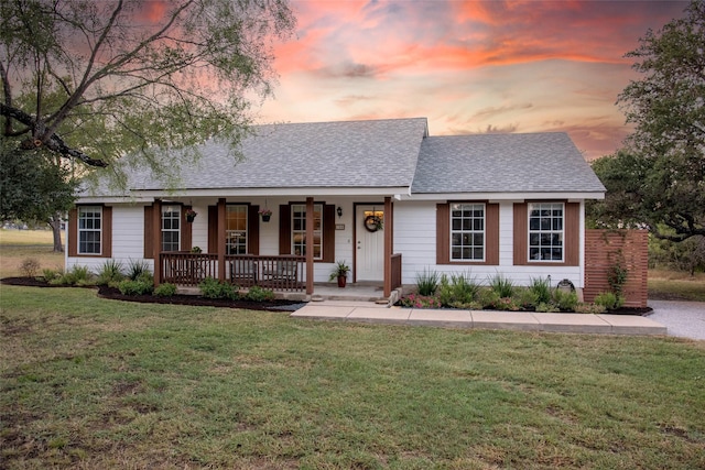 300 Coventry Rd, Spicewood, TX 78669 - view of front facade with a porch, roof with shingles, and a lawn